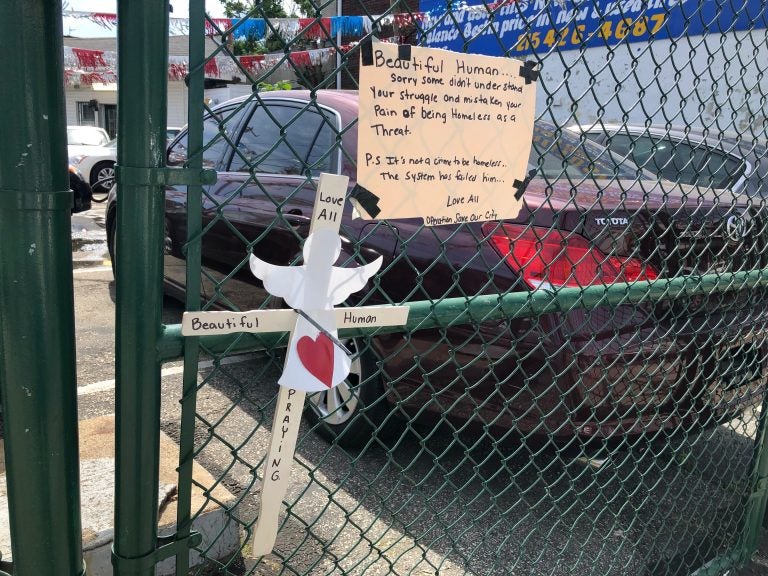 A fence near the scene of Monday night's shooting at G and Tioga streets holds tributes to Joel Johnson. Police have identified Detective Francis DiGiorgio as the shooter. (Nina Feldman/WHYY)