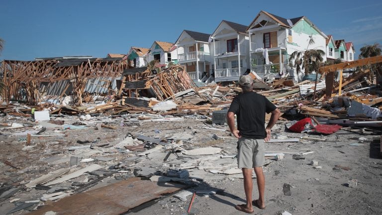 A resident of Mexico Beach, Fla., looks over damage caused to the Florida panhandle by Hurricane Michael in October 2018. (Scott Olson/Getty Images)