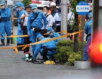 Police forensic experts investigate a crime scene where a man stabbed 19 people, including children in Kawasaki on May 28. Two people, including a child, are reportedly dead.