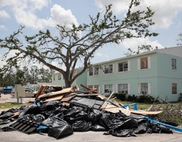 Debris is piled outside an apartment complex that was damaged by Hurricane Michael on May 10 in Panama City, Fla. Rep. Chip Roy objected to a procedural vote on a bipartisan $19.1 billion disaster aid bill, forcing Congress to wait until June to finish work on the legislation. (Scott Olson/Getty Images)