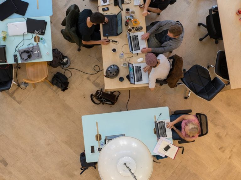 Above, an elevated view of start-ups in the Collective Temperance Hospital in London in 2016. (Lionel Derimais/Corbis via Getty Images)