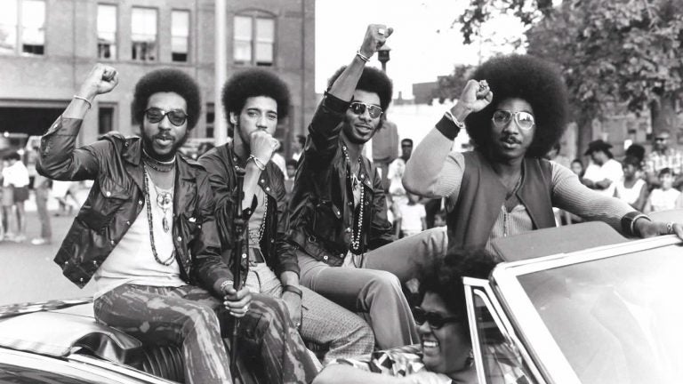 Members of the Nat Turner Rebellion ride in a parade during a Harambe Festival in Springfield, Mass., in the early 1970s. Pictured from left: Major Harris, Ron Hopper, Bill Stratley and Joe Jefferson (Courtesy of Reservoir Media)