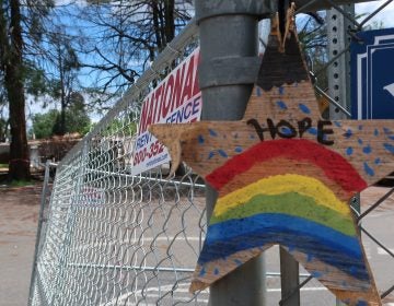 A homemade sign hangs on the fence surrounded Paradise Elementary School. The school was destroyed by the fire and the rubble is now being bulldozed and cleaned up.
(Michelle Wiley/KQED)