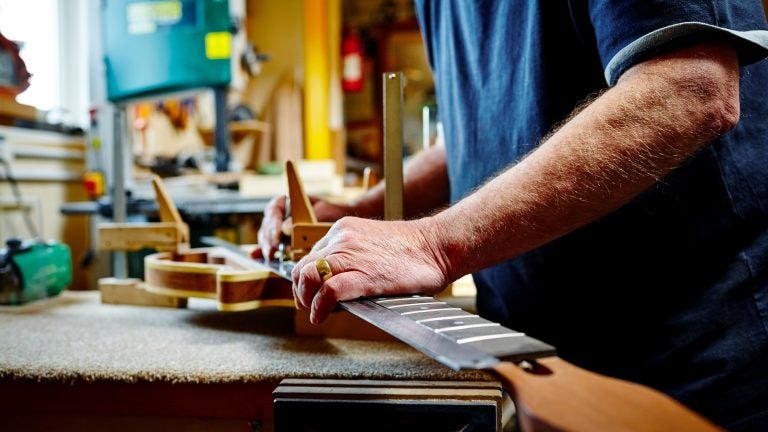 Having a purpose in life, whether building guitars or swimming or volunteer work, affects your health, researchers found. It even appeared to be more important for decreasing risk of death than exercising regularly. (Dean Mitchell/Getty Images)