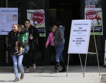 Signs advertising free measles vaccines and providing information about measles are displayed at the Rockland County Health Department in Pomona, N.Y. The county in New York City's northern suburbs has had more than 200 measles cases since last fall. (Seth Wenig/AP Photo)