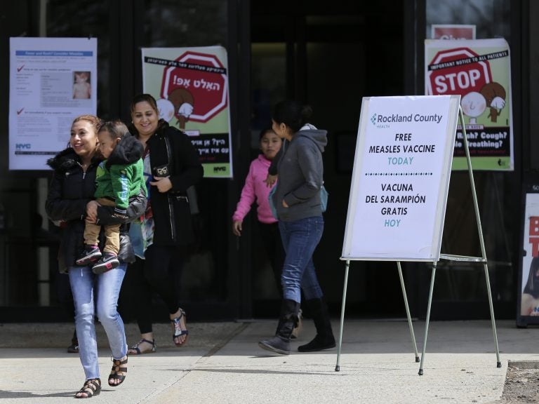 Signs advertising free measles vaccines and providing information about measles are displayed at the Rockland County Health Department in Pomona, N.Y. The county in New York City's northern suburbs has had more than 200 measles cases since last fall. (Seth Wenig/AP Photo)