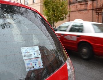 A residential parking permit on the back of a car