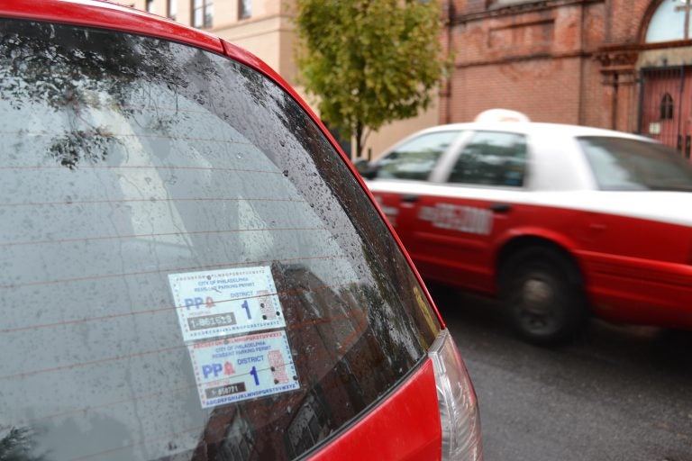 A residential parking permit on the back of a car