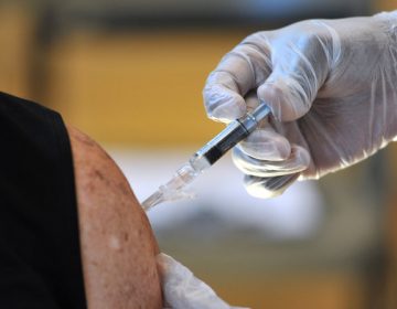 Many people might not be aware of what types of vaccines they need as they get older. Here, an adult gets a flu shot in Jacksonville, Fla. (Rick Wilson/AP images for Flu + You)