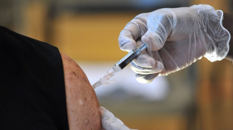 Many people might not be aware of what types of vaccines they need as they get older. Here, an adult gets a flu shot in Jacksonville, Fla. (Rick Wilson/AP images for Flu + You)