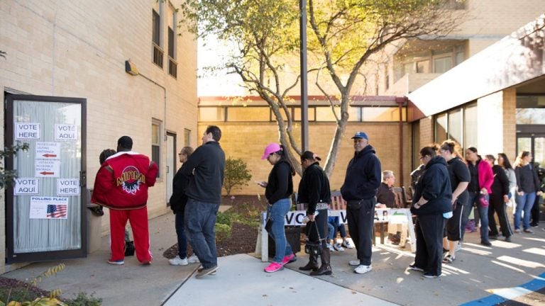 Voters line up outside the polls on Election Day in 2016 (WHYY, file)