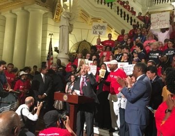 Philly Democrat Chris Rabb, who is sponsoring a bill to shift entirely to the Fair Funding formula, speaks at a rally. (Katie Meyer/WITF)