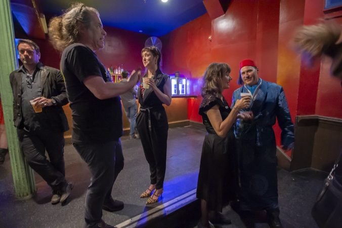 Performers and members of the audience mingle before the start of the show. (Jonathan Wilson for WHYY)