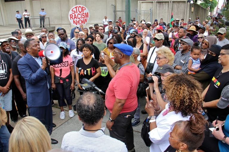 About 200 protesters gather at Philadelphia police headquarters to call for action against police officers who posted racist comments on Facebook. (Emma Lee/WHYY)