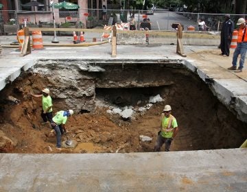 A sinkhole in Baltimore Avenue at 43rd Street was caused by a faulty sewer pipe. (Emma Lee/WHYY)