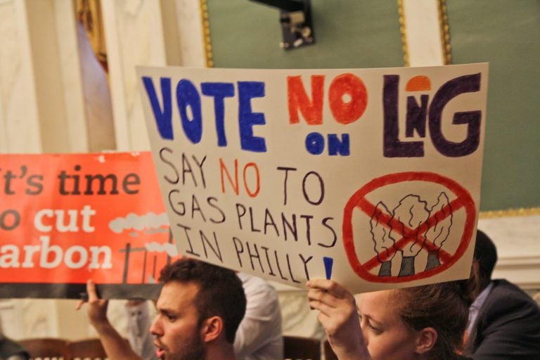 Opposition to the proposed liquefied natural gas plant in Philadelphia protest in city council chambers Thursday. (Kimberly Paynter/WHYY)