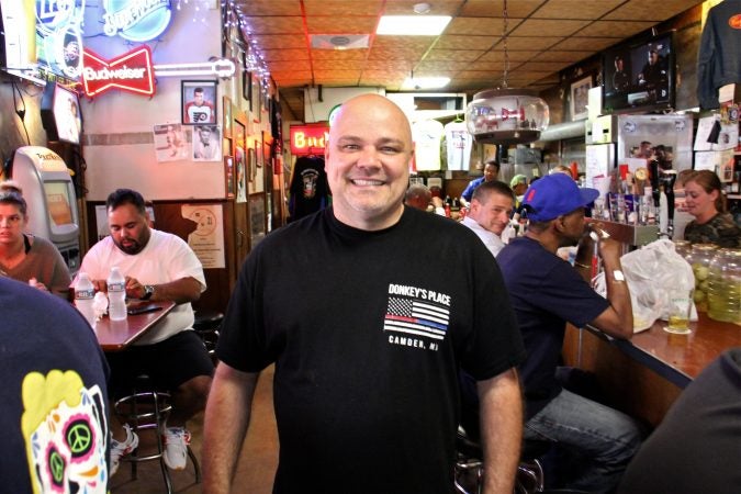 Donkey's Place owner Rob Lucas serves the Friday lunch crowd. His grandfather started the restaurant in Camden 76 years ago. (Emma lee/WHYY)