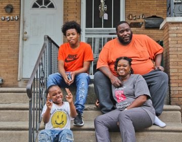 Janel Turner, (bottom right), her husband, and two of her sons, at their home in Philadelphia’s Nicetown neighborhood. (Kimberly Paynter/WHYY)