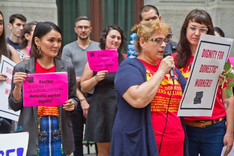 Activists, domestic workers, and government representatives gather outside City Hall Thursday morning before introducing the Domestic Workers' Bill of Rights legislation to city council. (Kimberly Paynter/WHYY)