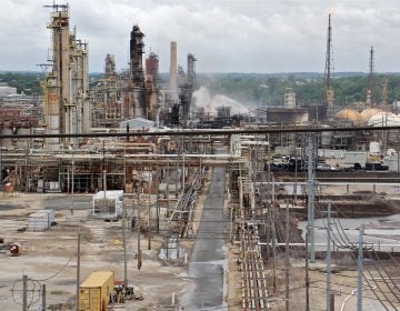 A fire burns at the Philadelphia Energy Solutions refinery hours after a series of early morning explosions at the 150-year-old industrial complex at 3100 W. Passyunk Ave. (Emma Lee/WHYY)