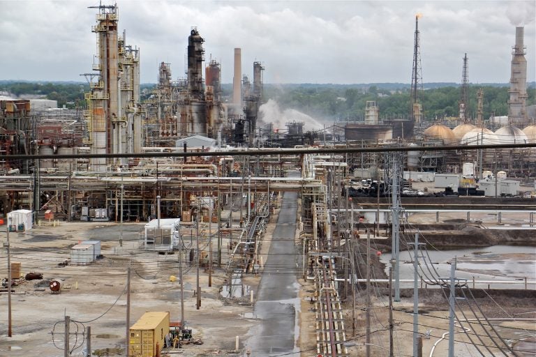 A fire burns at the Philadelphia Energy Solutions refinery hours after a series of early morning explosions at the 150-year-old industrial complex at 3100 W. Passyunk Ave. (Emma Lee/WHYY)