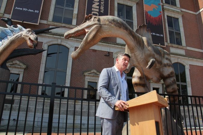Scott Cooper, president of the Academy of Natural Sciences of Drexel University, introduces a new exhibit featuring animatronic dinosaurs, 