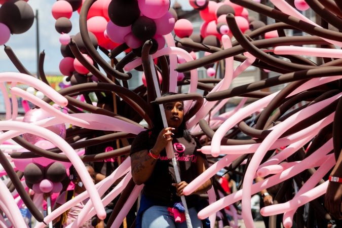 The Juneteenth Parade makes its way down 52nd Street in West Philadelphia Saturday where it was being held for the first year after moving from Center City Philadelphia. (Brad Larrison for WHYY)