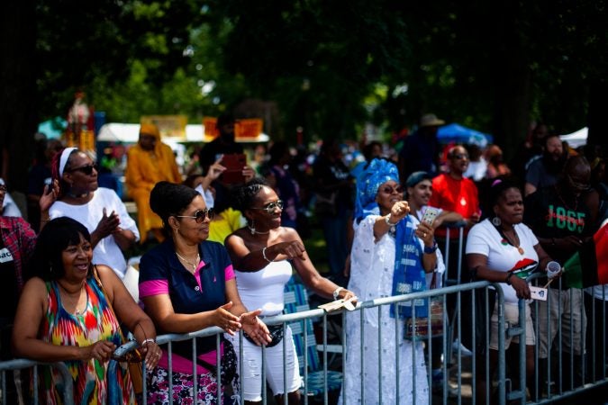 The Juneteenth Parade makes its way down 52nd Street in West Philadelphia Saturday where it was being held for the first year after moving from Center City Philadelphia. (Brad Larrison for WHYY)