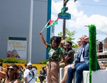 The Juneteenth Parade makes its way down 52nd Street in West Philadelphia in June 2019 where it was being held for the first year after moving from Center City. (Brad Larrison for WHYY)