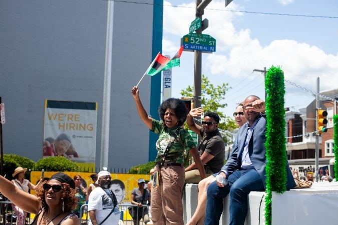 The Juneteenth Parade makes its way down 52nd Street in West Philadelphia in June 2019 where it was being held for the first year after moving from Center City. (Brad Larrison for WHYY)