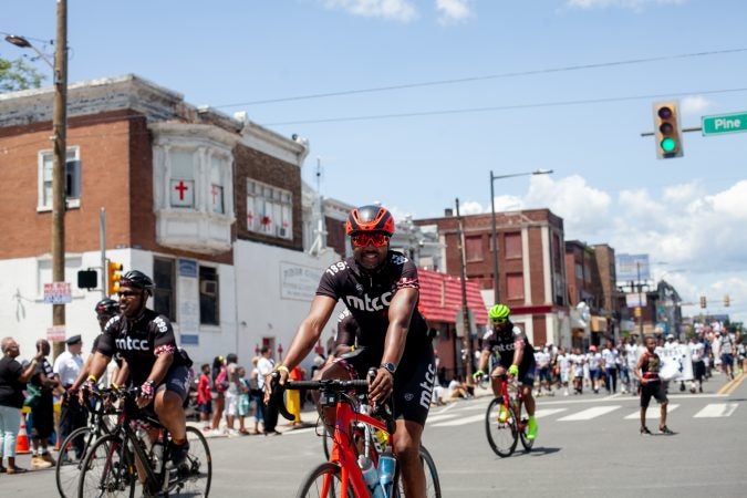 The Juneteenth Parade makes its way down 52nd Street in West Philadelphia Saturday where it was being held for the first year after moving from Center City Philadelphia. (Brad Larrison for WHYY)