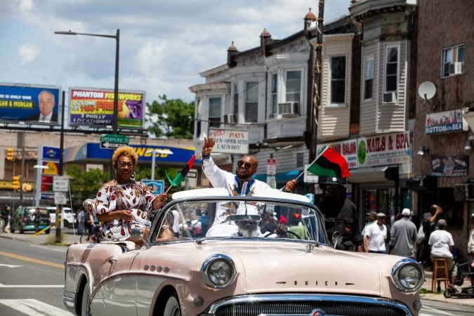 The Juneteenth Parade makes its way down 52nd Street in West Philadelphia Saturday where it was being held for the first year after moving from Center City Philadelphia. (Brad Larrison for WHYY)