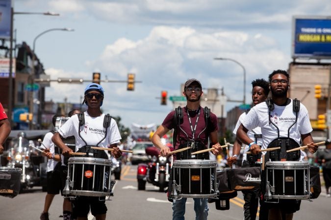 The Juneteenth Parade makes its way down 52nd Street in West Philadelphia Saturday where it was being held for the first year after moving from Center City Philadelphia. (Brad Larrison for WHYY)
