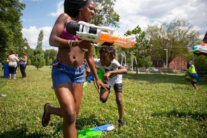 Families from across Philadelphia came to Fairmount Park to participate in the Water Fight Philly event on Sunday, June 30, 2019. (Kriston Jae Bethel for WHYY)