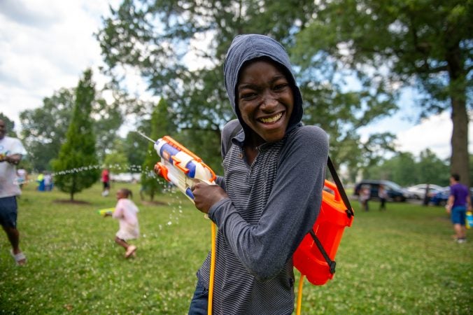 Yasir Washington, 12, participates in the Water Fight Philly event on Sunday, June 30, 2019. (Kriston Jae Bethel for WHYY)