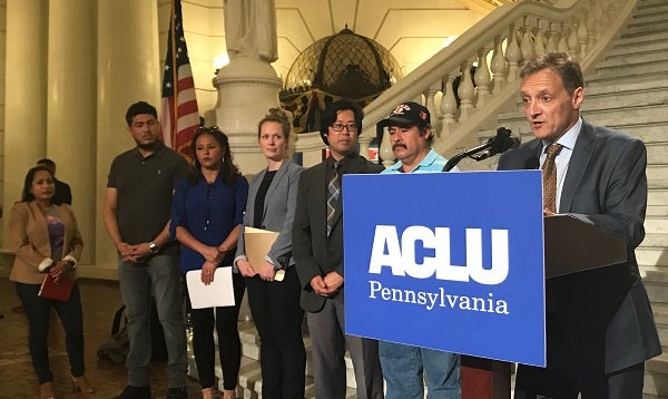 PA ACLU Legal Director Vic Walczak speaks at a press conference announcing the lawsuit alongside fellow attorneys and plaintiffs in the case. (Katie Meyer/WITF)