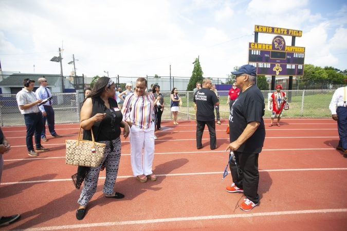 A group tours the Camden High School athletic facilities on Thursday, June 6, 2019 (Miguel Martinez for WHYY)