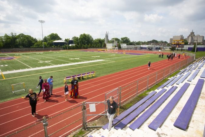 A group tours the Camden High School athletic facilities on Thursday, June 6, 2019 (Miguel Martinez for WHYY)