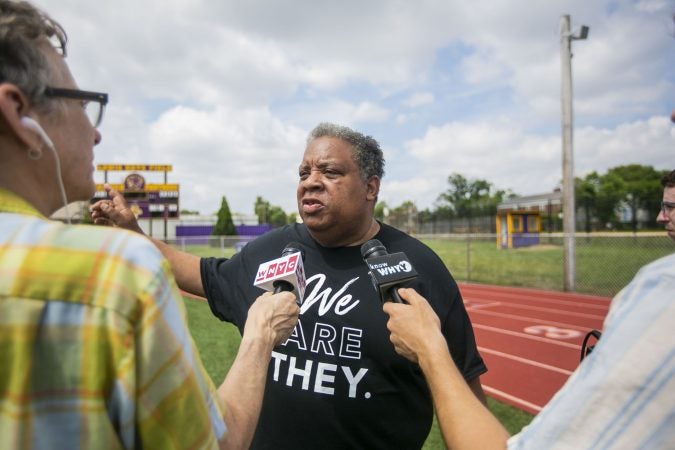 Keith Benso is interviewed at Camden High School during a group tour (Miguel Martinez for WHYY)