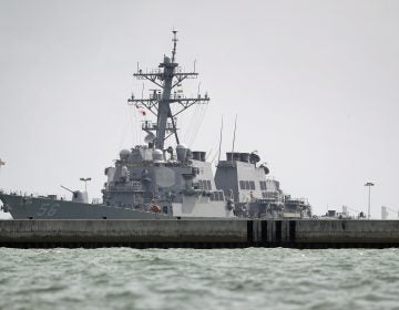 The USS John S. McCain is seen docked at Changi naval base  on Monday, Aug. 21, 2017 in Singapore. (AP Photo/Wong Maye-E)