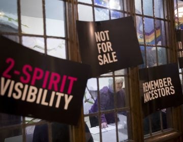 In this Wednesday, March 27, 2019, photo, a participant checks in as she arrives for a meeting of the Reclaim Pride Coalition at the Church of the Village in New York. Activists who believe New York City’s annual LGBTQ Pride march has become too commercialized are staging an alternative march the same day. The two marches through Manhattan streets will take place Sunday, June 30, the last day of a month of celebrations marking the 50th anniversary of the 1969 Stonewall uprising. (Mary Altaffer/AP Photo)