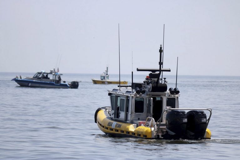 In this photo provided by the United States Coast Guard, a pair of Sea Tow boats joins another vessel off Cape May Point, N.J., in the search for a single engine airplane that crashed into the Atlantic Ocean, Wednesday, May 29, 2019. The aircraft's owner says the male pilot was a regular customer who flew recreationally. (Petty Officer 2nd Class Ryan Keegan/United States Coast Guard via AP)