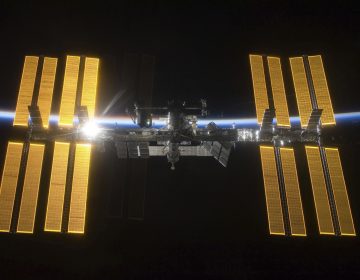 This March 25, 2009 photo provided by NASA shows the International Space Station seen from the Space Shuttle Discovery during separation.  NASA announced Friday, June 7, 2019 that it will open the International Space Station to private astronauts, with the first visit as early as next year. (NASA via AP)