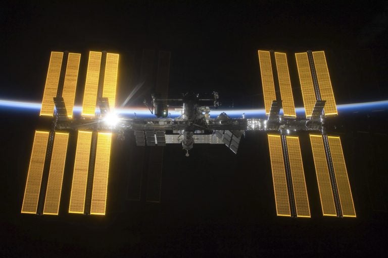 This March 25, 2009 photo provided by NASA shows the International Space Station seen from the Space Shuttle Discovery during separation.  NASA announced Friday, June 7, 2019 that it will open the International Space Station to private astronauts, with the first visit as early as next year. (NASA via AP)