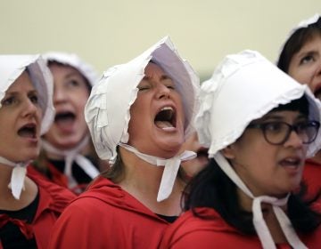 In this Tuesday, May 23, 2017 file photo, activists dressed as characters from 'The Handmaid's Tale' chant in the Texas Capitol Rotunda as they protest SB8, a bill that would require health care facilities, including hospitals and abortion clinics, to bury or cremate any fetal remains whether from abortion, miscarriage or stillbirth, and they would be banned from donating aborted fetal tissue to medical researchers in Austin. Tissue left over from elective abortions has been used in scientific research for decades, and is credited with leading to lifesaving vaccines and other advances. (Eric Gay/AP Photo)