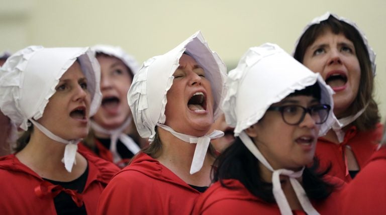 In this Tuesday, May 23, 2017 file photo, activists dressed as characters from 'The Handmaid's Tale' chant in the Texas Capitol Rotunda as they protest SB8, a bill that would require health care facilities, including hospitals and abortion clinics, to bury or cremate any fetal remains whether from abortion, miscarriage or stillbirth, and they would be banned from donating aborted fetal tissue to medical researchers in Austin. Tissue left over from elective abortions has been used in scientific research for decades, and is credited with leading to lifesaving vaccines and other advances. (Eric Gay/AP Photo)
