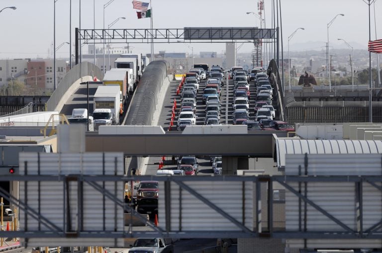 FILE - In this March 29, 2019, file photo, cars and trucks line up to enter the U.S. from Mexico at a border crossing in El Paso, Texas. Authorities in far South Texas say U.S. Border Patrol agents have discovered the bodies of four people, including three children, who appeared to have died from heat exposure after crossing the Rio Grande. Hidalgo County sheriff's Sgt. Frank Medrano said the bodies of a woman in her early 20s, a toddler and two infants were found Sunday, June, 23, 2019, in or near Anzalduas Park, which borders the river in the city of Mission. (AP Photo/Gerald Herbert, File)