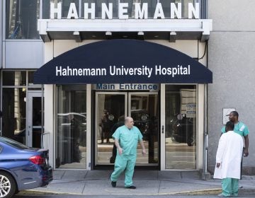 A person exits Hahnemann University Hospital in Philadelphia, Wednesday, June 26, 2019.  (AP Photo/Matt Rourke)