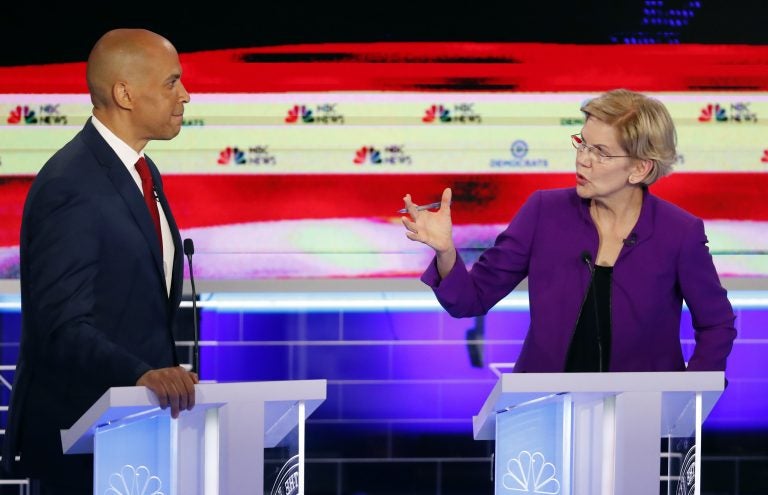 Democratic presidential candidate Sen. Elizabeth Warren, D-Mass., gestures towards New Jersey Sen. Cory Booker, during a Democratic primary debate hosted by NBC News at the Adrienne Arsht Center for the Performing Arts, Wednesday, June 26, 2019, in Miami. (Wilfredo Lee/AP Photo)