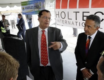 Kris Singh, center, the founder, president and CEO of Holtec International. The company was granted the second-largest tax break in state history, but officials placed a hold on the break following our reporting. (Mel Evans/AP Photo)